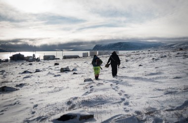 Markoosi and Nanasi Illauq walk to Clyde River's tiny harbor to set off for a day of hunting. For many Inuit, hunting represents a link to millennia of tradition—but those links are rapidly weakening in a changing climate.