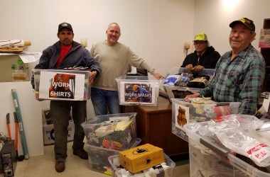 People gather together work supplies at Centro Humanitario in Denver, Colorado.