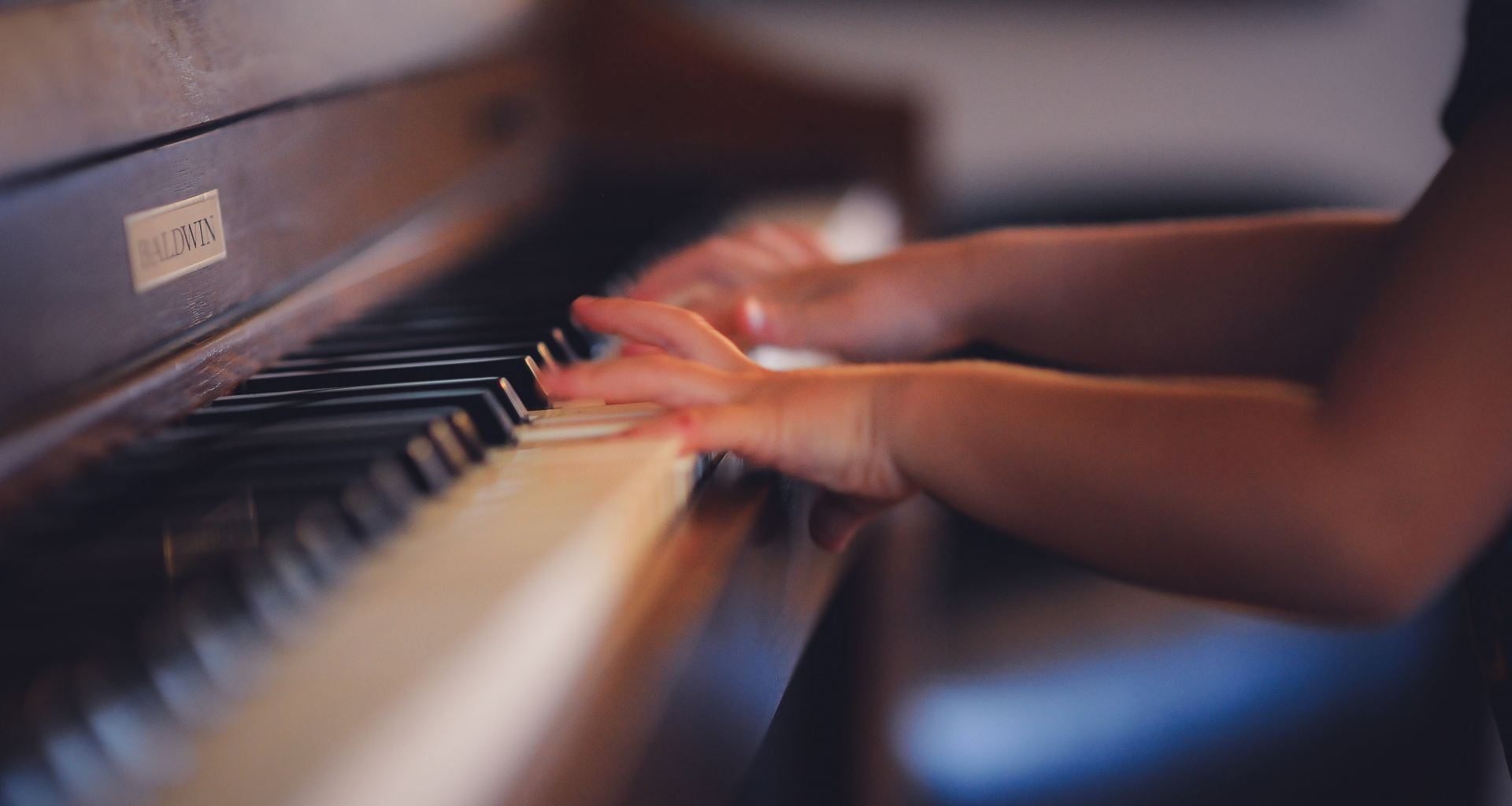 Child playing piano music arts education