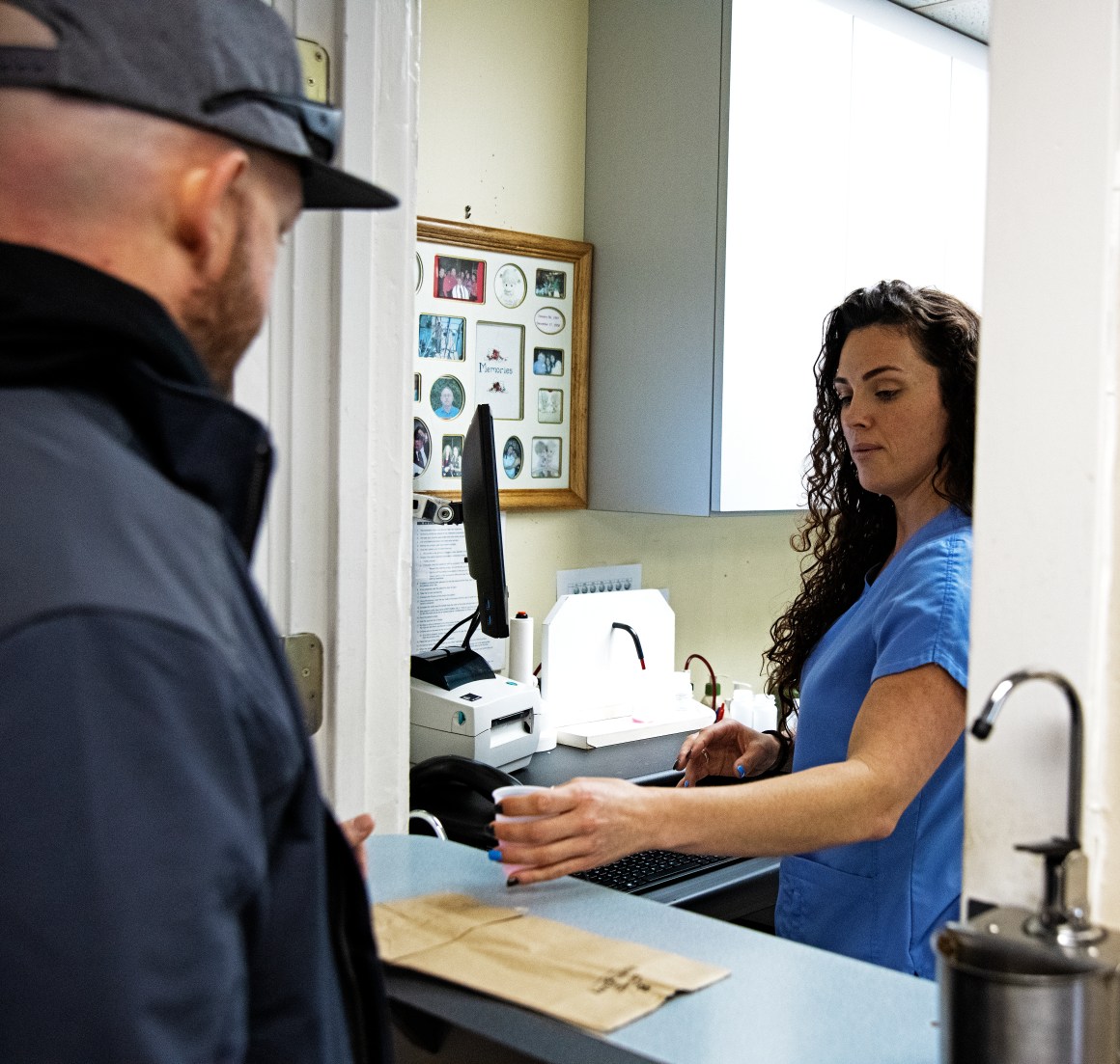 A client receives his dose of methadone from a dispensing nurse at C.O.R.E. Medical Clinic in Sacramento, California, on March 13th, 2019.