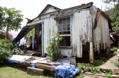 Flora's former house, which collapsed during Cyclone Winston. When it rains, the families hang clothes to dry under the remaining roof because there's no room in the tents.