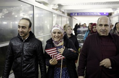 Photo showing a Syrian family walking through O'Hare airport in Chicago