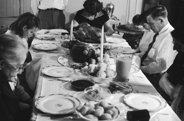 An American family saying pre-Thanksgiving grace, circa 1955.