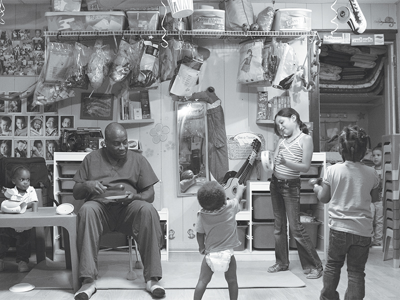 Co-owner Patrick Hogan plays music with some of Dee's Tots' 