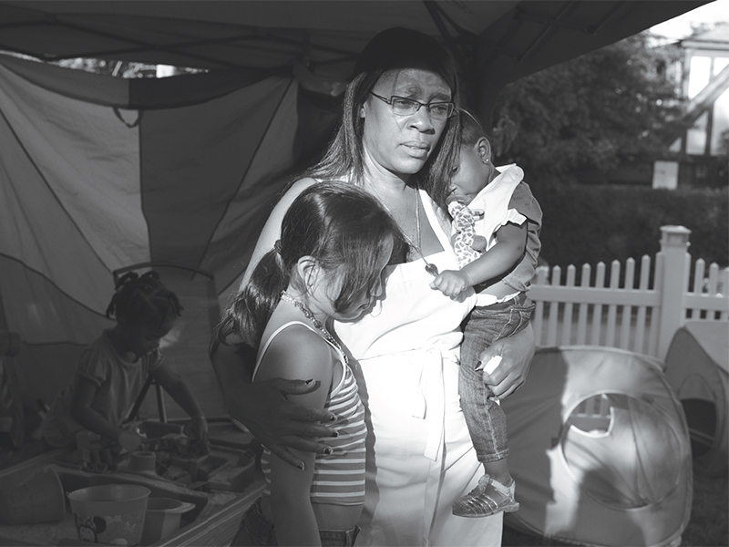 Deloris holds eight-year-old Diana, along with her own two-year-old granddaughter, Jadeleana.