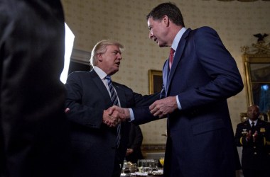 President Donald Trump shakes hands with James Comey, director of the Federal Bureau of Investigation, during an Inaugural Law Enforcement Officers and First Responders Reception in the Blue Room of the White House on January 22nd, 2017, in Washington, D.C.