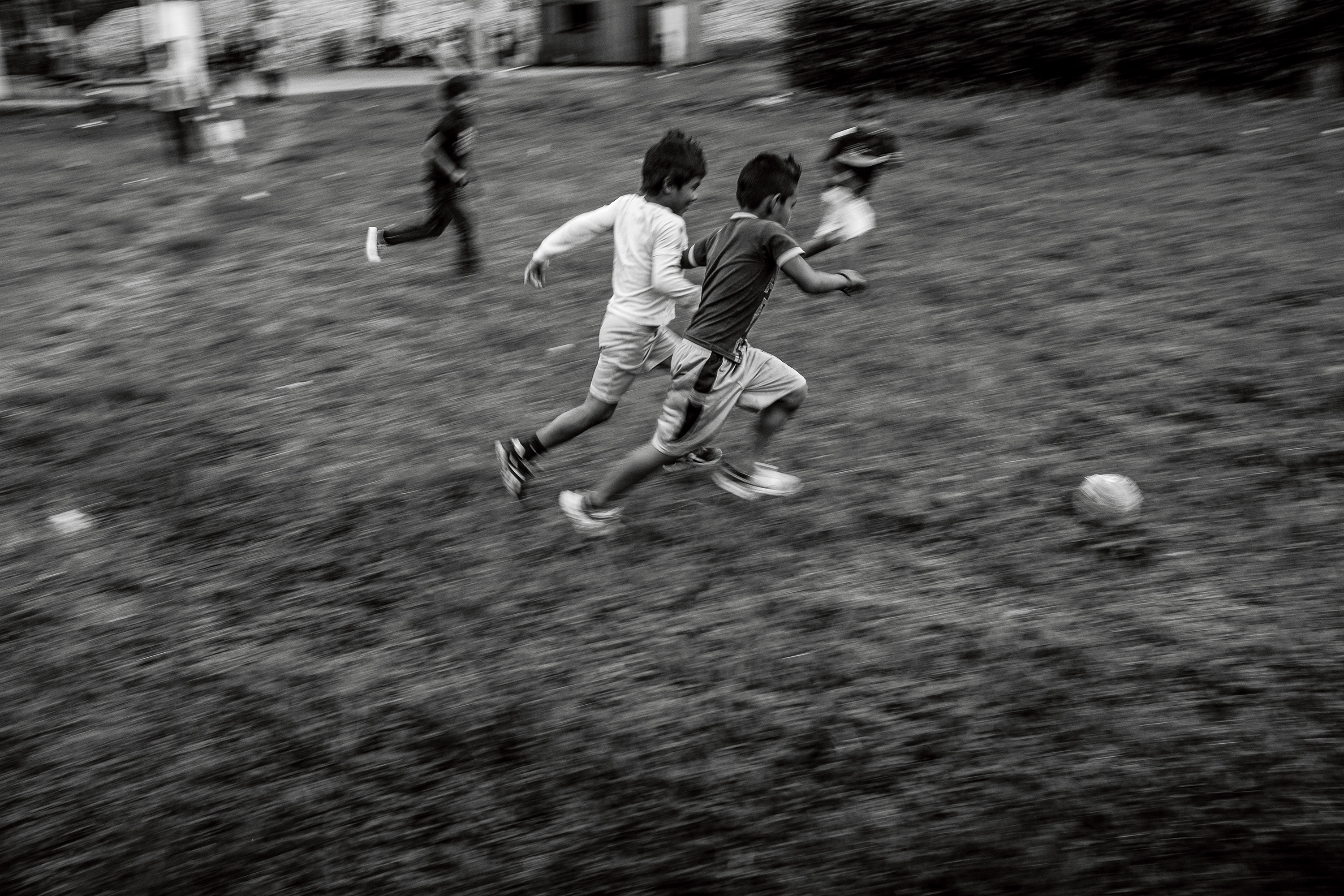 Cofán boys playing soccer in Dureno. Both children and young adults play soccer and volleyball nearly every afternoon.