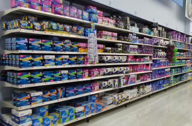 Feminine hygiene products such as tampons and pads in a Walmart aisle