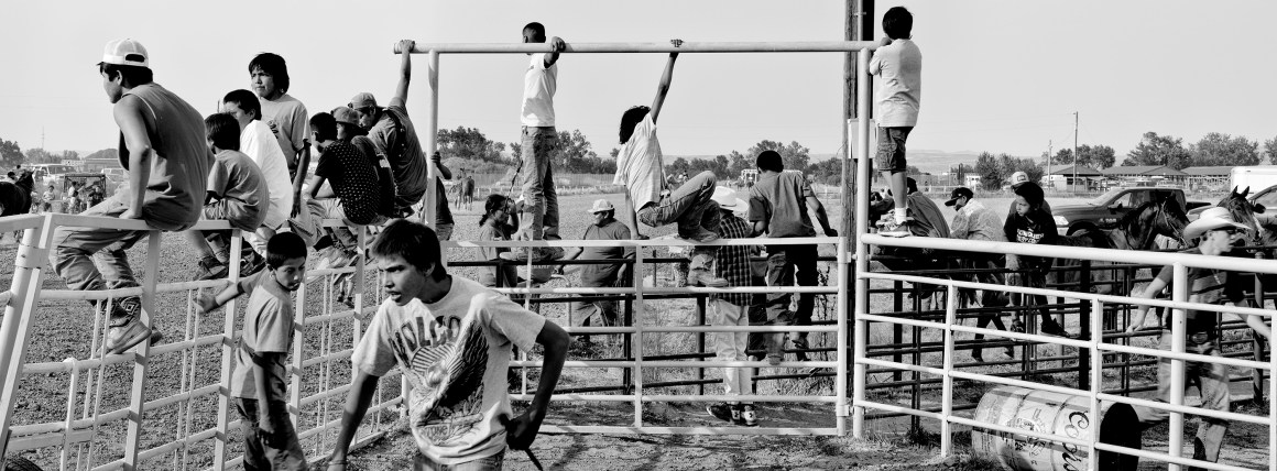 Crow Reservation, Montana: In Big Horn County, people watch a horse race during the 99th annual Crow Fair, one of the longest-running Native American gatherings in the United States.