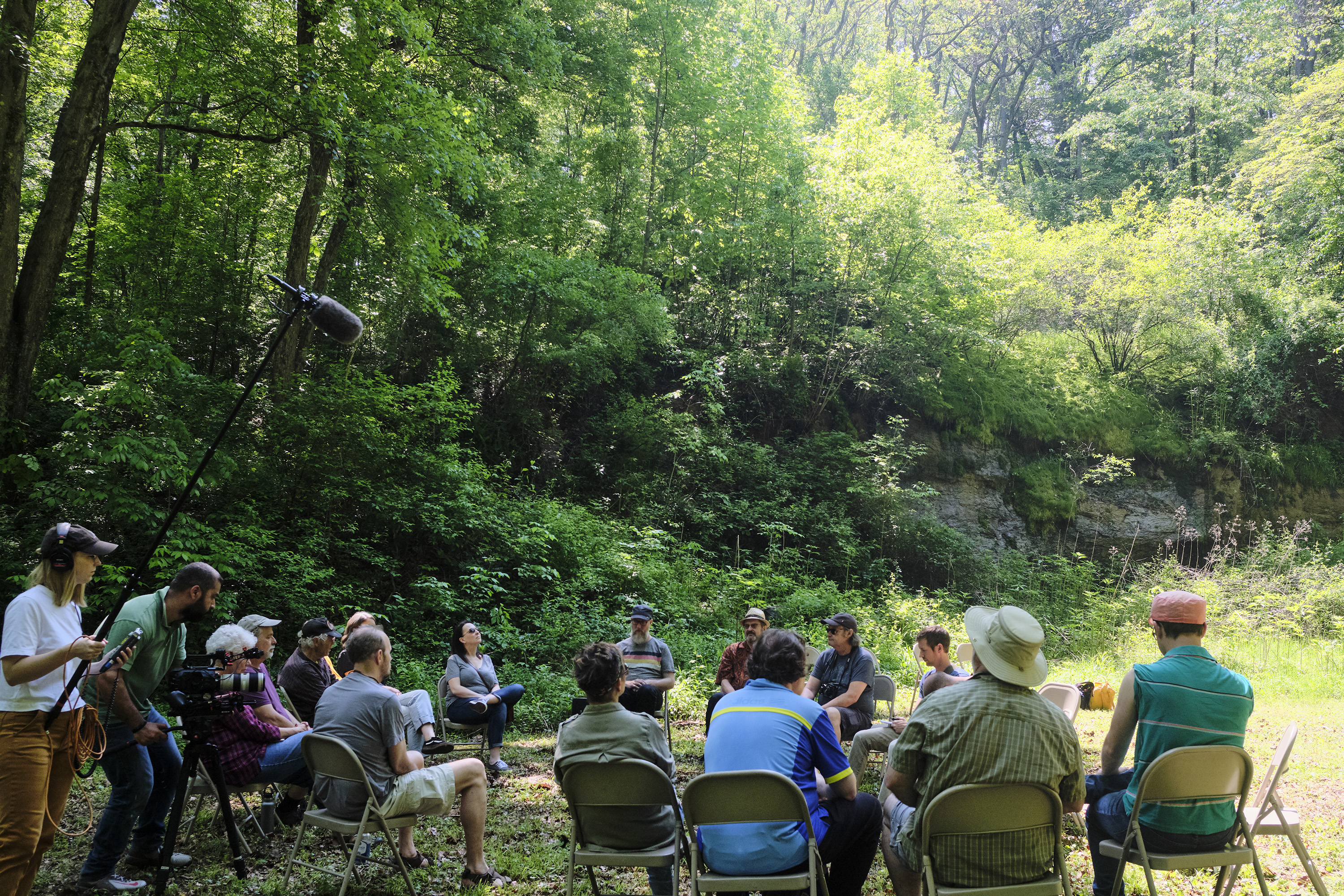 A film crew from A Blade of Grass documents a Forest Listening Room at Robinson's Cave in Wayne National Forest in May.