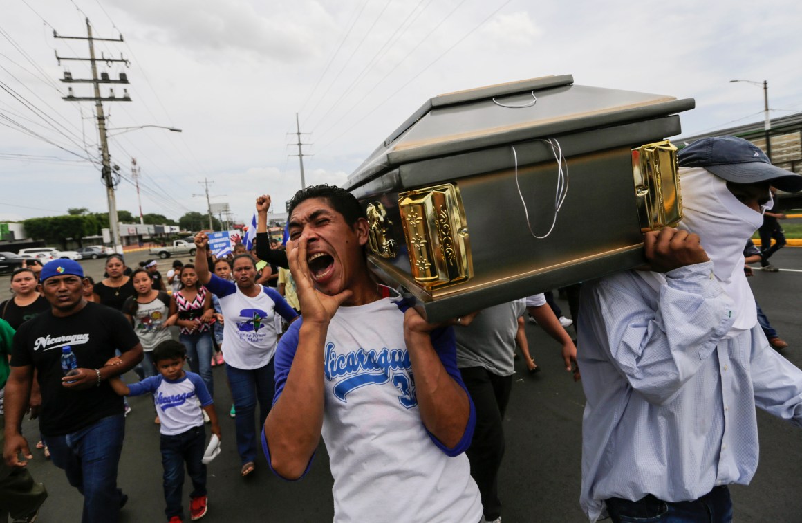 Friends and relatives carry the coffin containing the body of the student Gerald Velazquez, shot dead during clashes with riot police in a church near the National Autonomous University of Nicaragua in Managua on July 16th, 2018. Government forces in Nicaragua on Saturday shot dead two young men at a protest site in a church, the clergy said, on the third day of nationwide demonstrations against President Daniel Ortega, a former revolutionary hero now accused of authoritarianism.