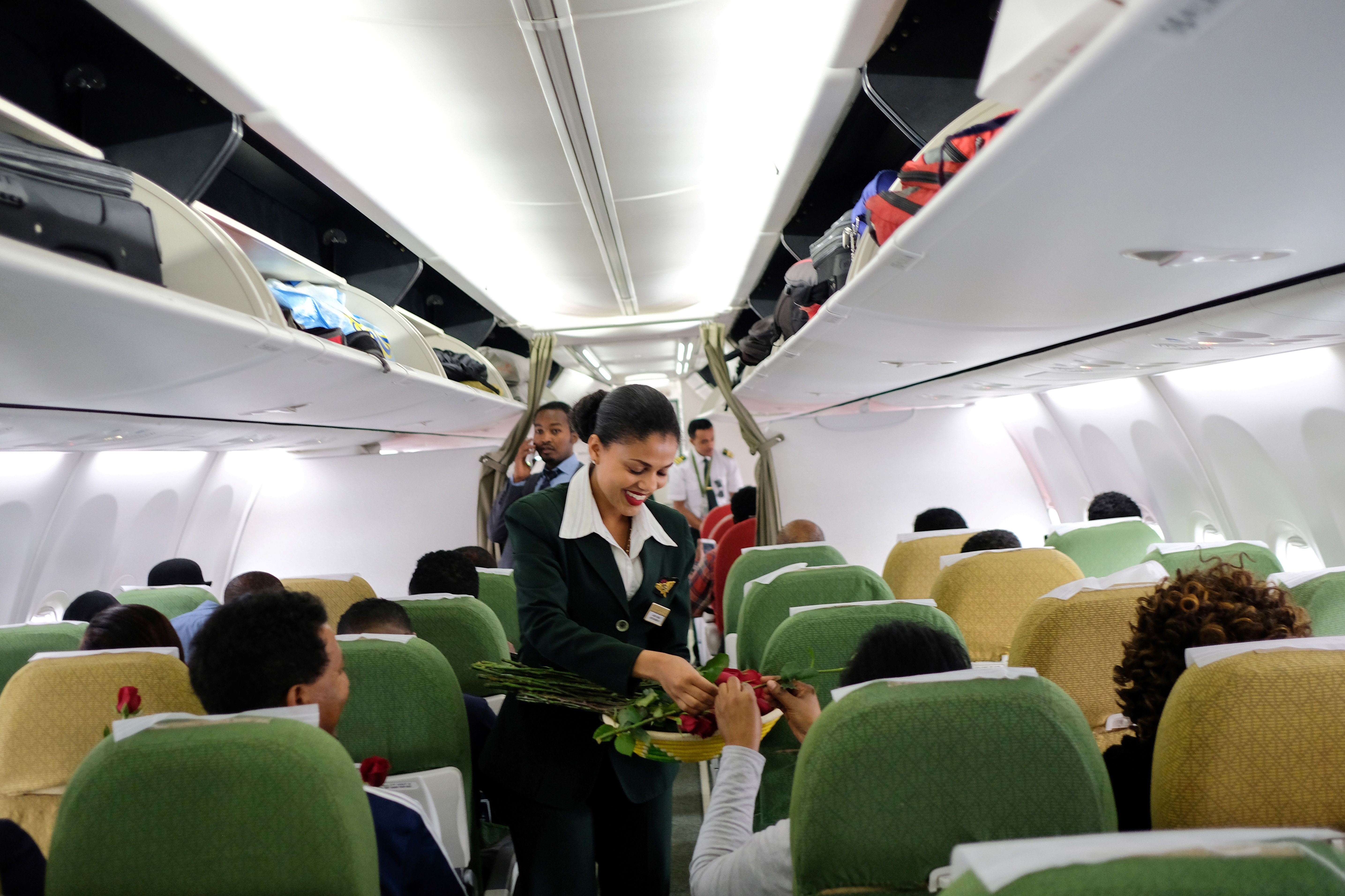 Ethiopian Airlines crew welcome passengers onboard the first commercial flight departing from Addis Ababa, Ethiopia, to Eritrea's capital of Asmara on July 18th, 2018.