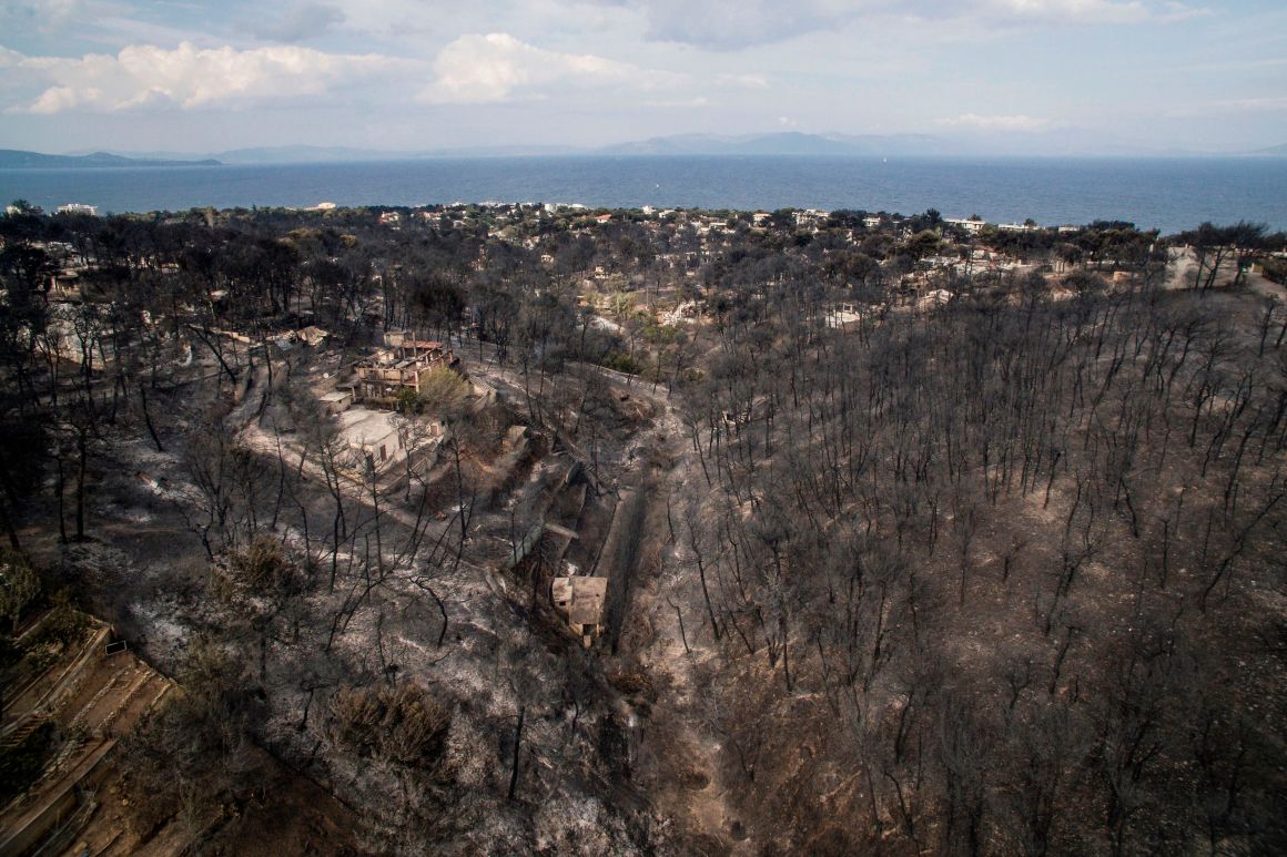 An aerial view shows damage caused by a wildfire near the village of Mati, near Athens, on July 24th, 2018. More than 70 have died and 170 have been injured in wildfires ravaging woodland and villages in the Athens region. The death toll soared with a Red Cross official reporting the discovery of 26 bodies in the courtyard of a villa at the seaside resort of Mati.