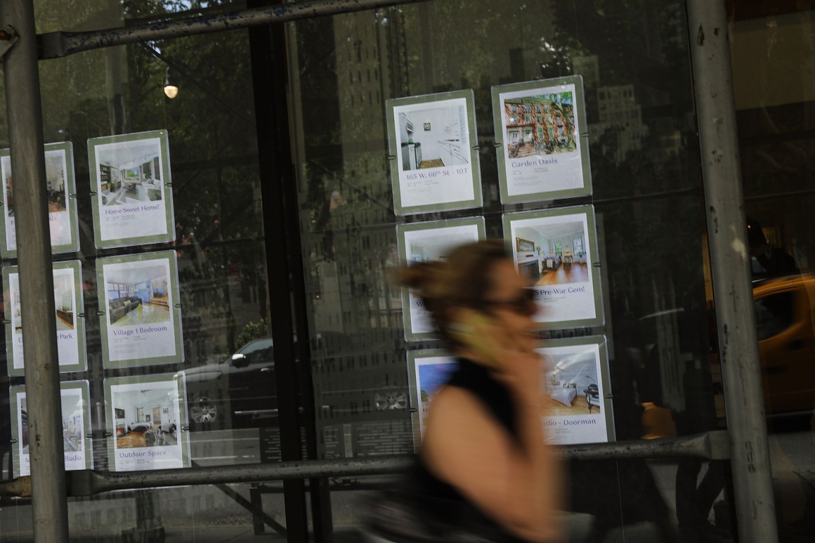 Luxury apartments are advertised in a realtor's window on the West Side of Manhattan on July 24th, 2018.