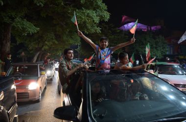 Supporters of Pakistan's cricketer-turned politician Imran Khan, head of the Pakistan Tehreek-e-Insaf (Movement for Justice) Party, celebrate on a street during the general election in Islamabad on July 25th, 2018. Pakistan's incumbent party rejected early election results Thursday that suggested Khan was on his way to becoming the country's next prime minister, alleging "blatant" rigging.