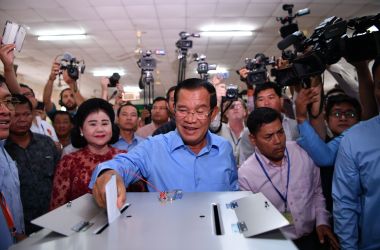 Cambodia's Prime Minister Hun Sen casts his vote during the general elections as his wife Bun Rany looks on in Phnom Penh on July 29th, 2018.