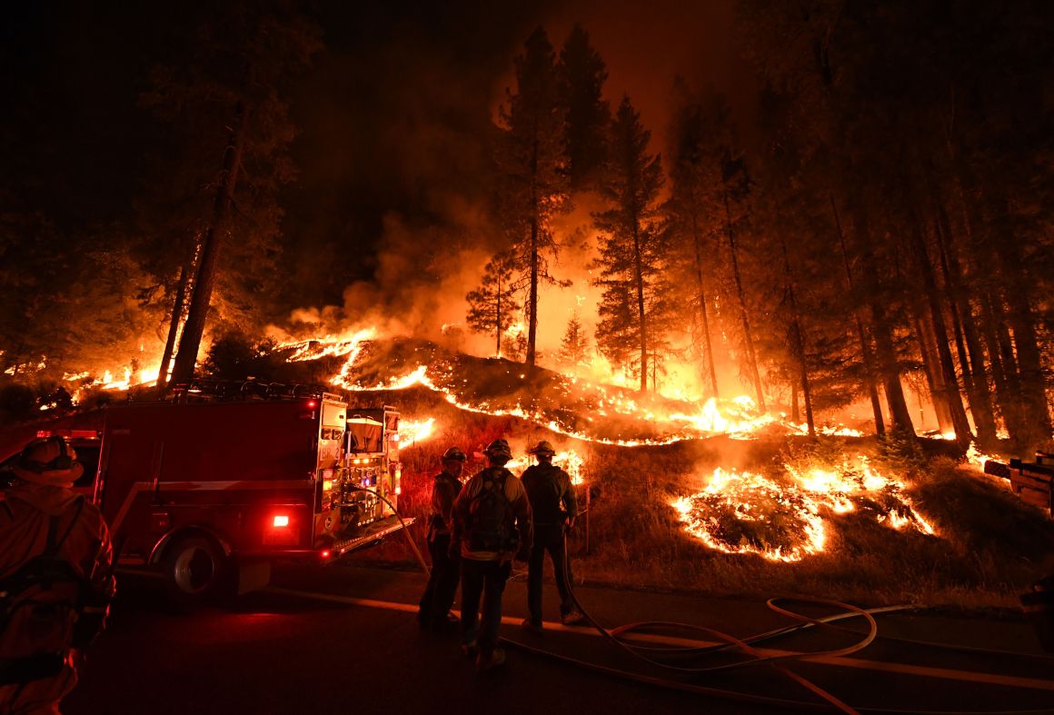 Firefighters try to control a back burn as they battle the Carr Fire near Redding, California, on July 31st, 2018.