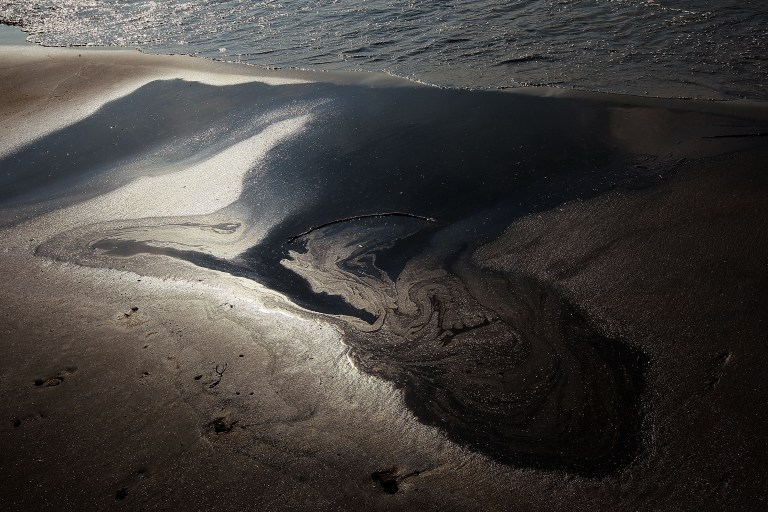 Oil floats ashore at the Grand Isle East State Park on May 27th, 2010, on Grand Isle, Louisiana.