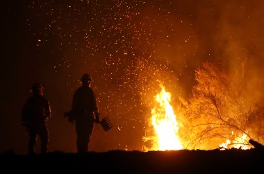 Firefighters battle the Medocino Complex Fire on August 7th, 2018, near Lodoga, California.