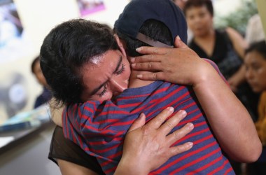 Isidra Larena Calderon hugs her son Jonathan Leonardo on August 7th, 2018 in Guatemala City, Guatemala, as the two are reunited months after U.S. border agents separated them.