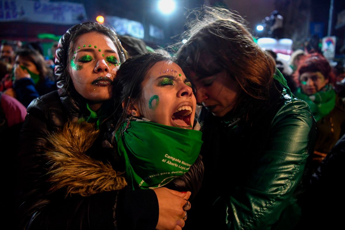 Abortion rights activists comfort each other outside the National Congress in Buenos Aires, Argentina, on August 9th, 2018, after senators rejected a bill that would have legalized abortion. Argentine senators voted against the bill on Thursday, dashing the hopes of women's rights groups after the bill was approved by Congress' lower house in June.