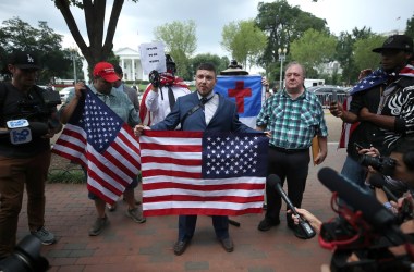 Jason Kessler (center), who organized the Unite the Right rally, speaks on August 12th, 2018, in Washington, D.C.