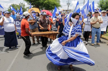 Anti-government protesters play traditional music and dance as they take part in a march demanding the release of political prisoners in Managua, Nicaragua, on August 15th, 2018.