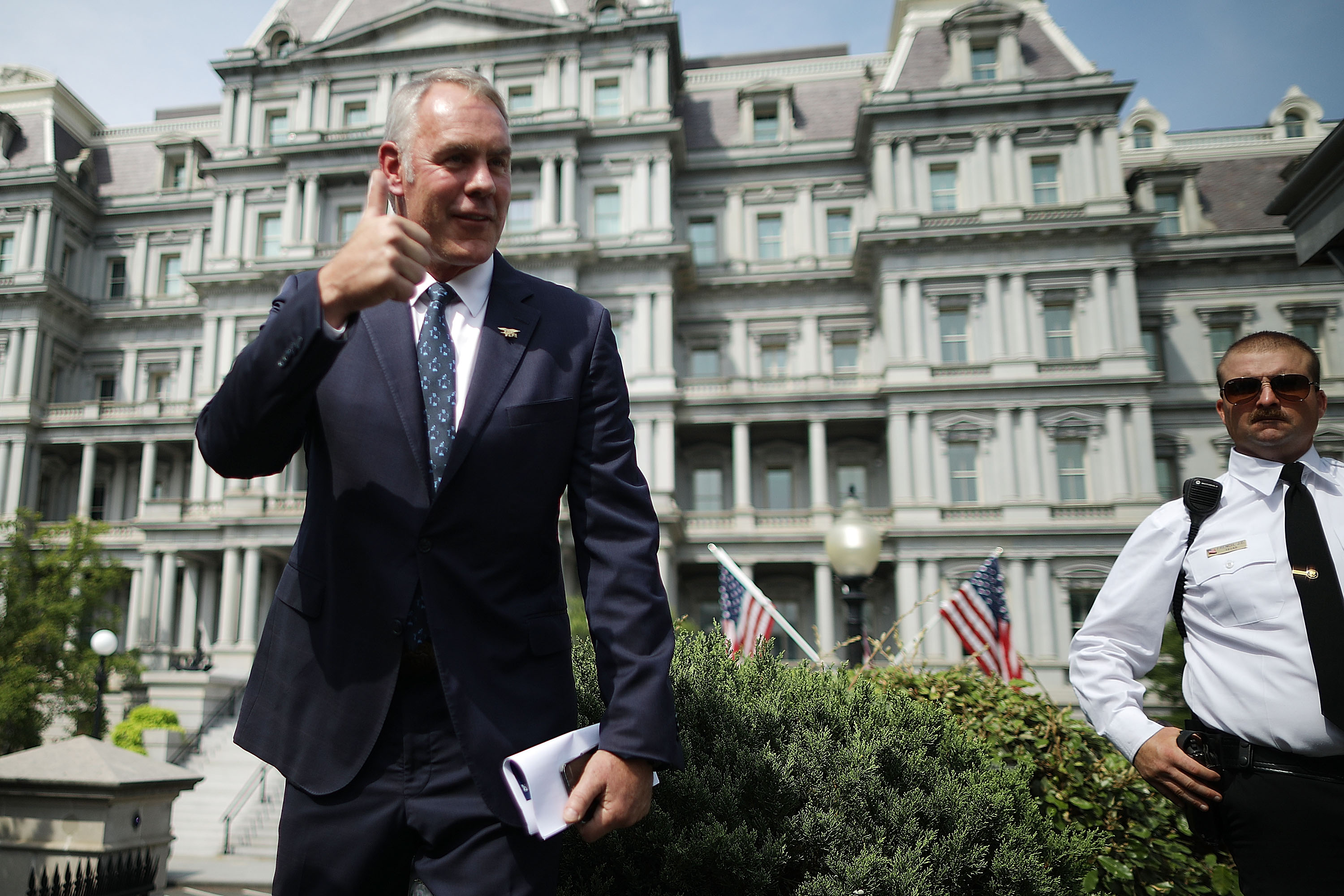 Secretary of the Interior Ryan Zinke talks to journalists outside the White House before a cabinet meeting with President Donald Trump on August 16th, 2018.