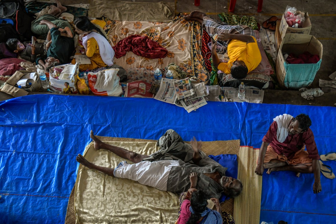 People rest at a relief camp in Aluva on August 22nd, 2018, in Kerala, India, where rescue efforts continue this week. Over 400 people have reportedly died in Kerala after weeks of monsoon rains, which forced more than one million people to take shelter in thousands of relief camps across the southern state.