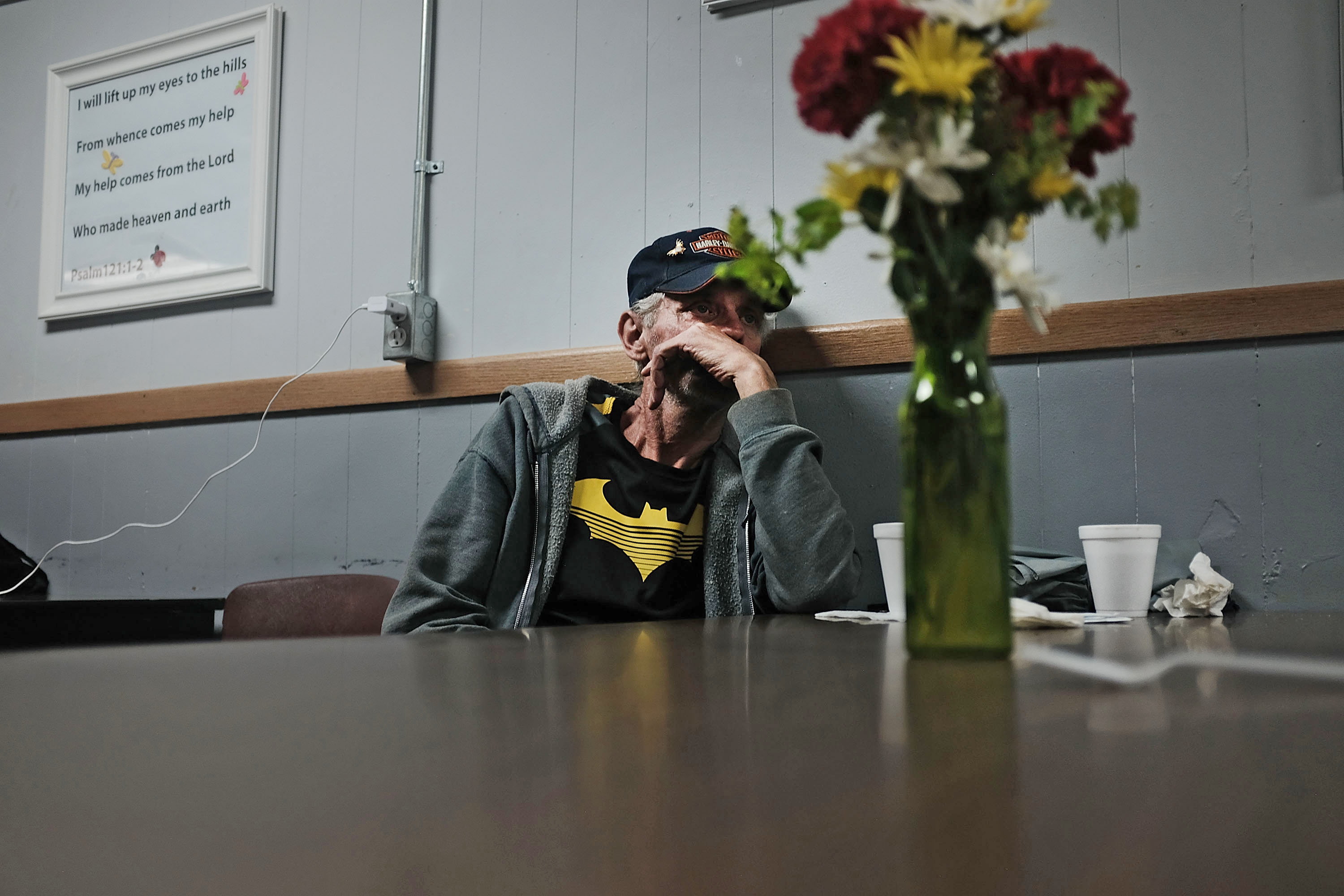 People wait for lunch at a soup kitchen in Clarksburg on August 22nd, 2018, in Clarksburg, West Virginia. Despite a strong economy in many parts of America, West Virginia, a state that voted overwhelmingly for Donald Trump in the 2016 election, still struggles with endemic poverty and opioid abuse.