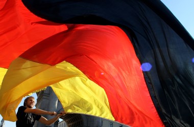 A man waves a German flag.