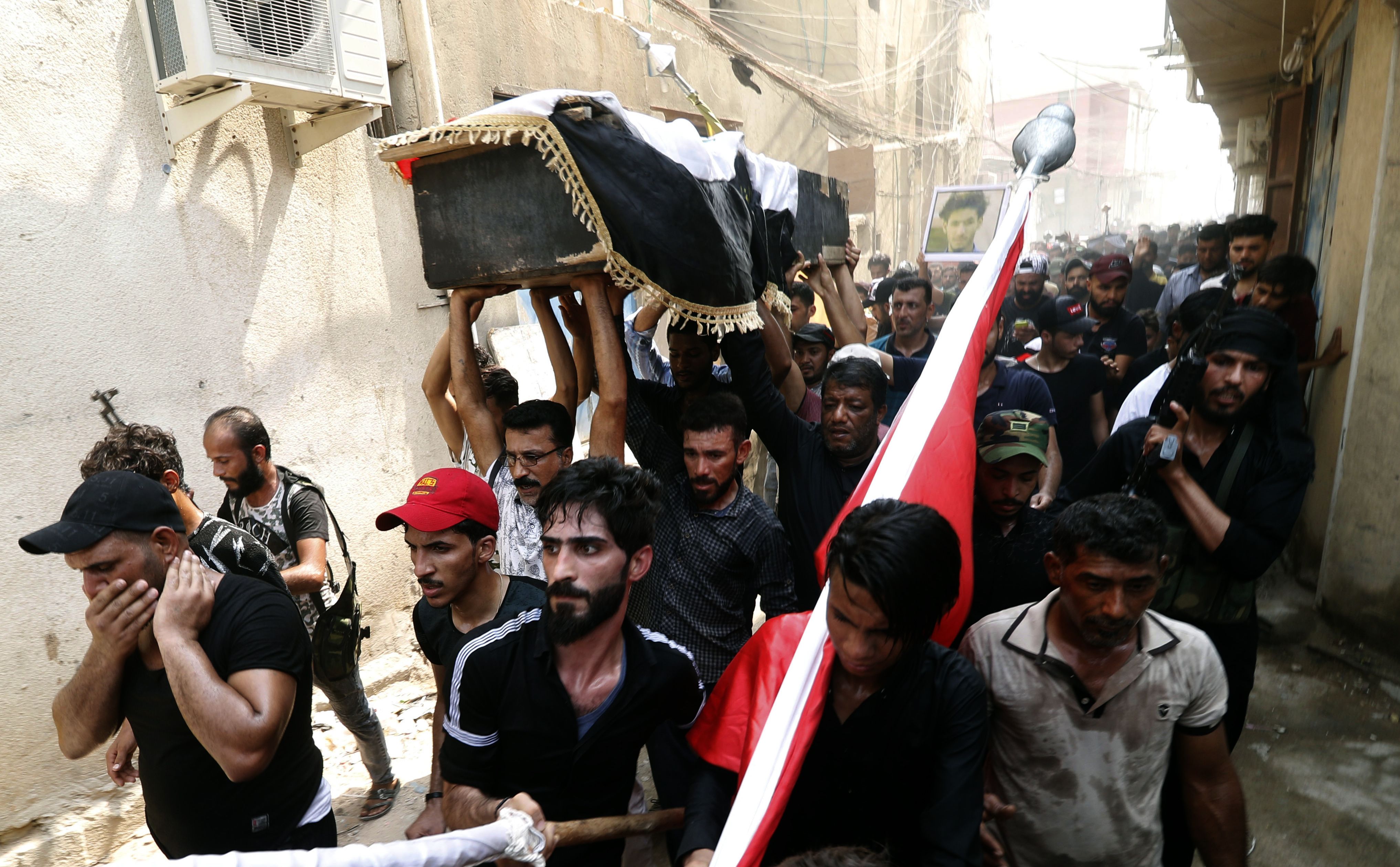 Iraqi protesters carry the coffin of a man on September 4th, 2018. Family and human rights activists claim the man was killed by bullets shot the previous day as he demonstrated against the government and the lack of basic services.