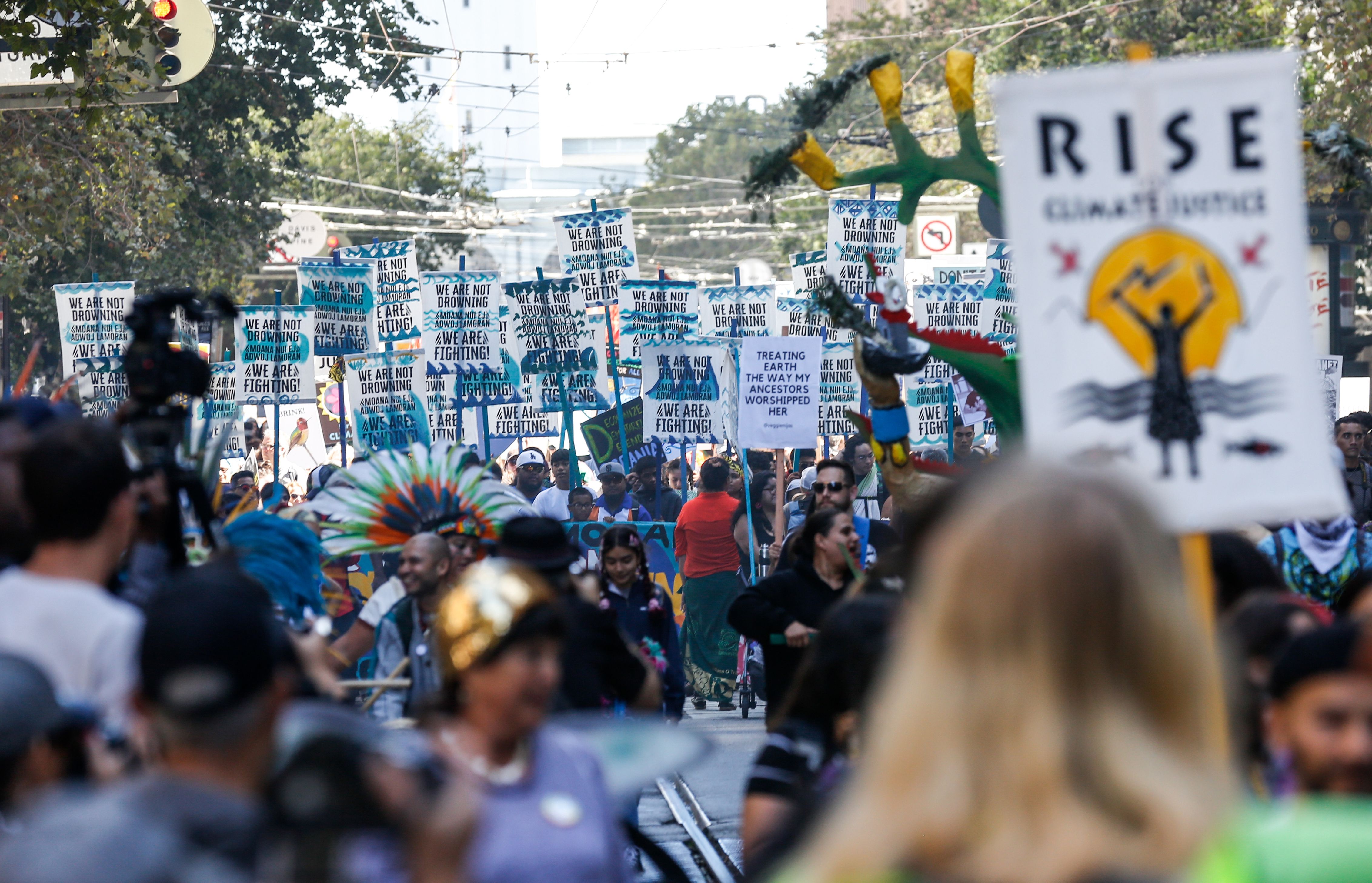 Crowds march up Market Street in downtown San Francisco on September 8th, 2018.