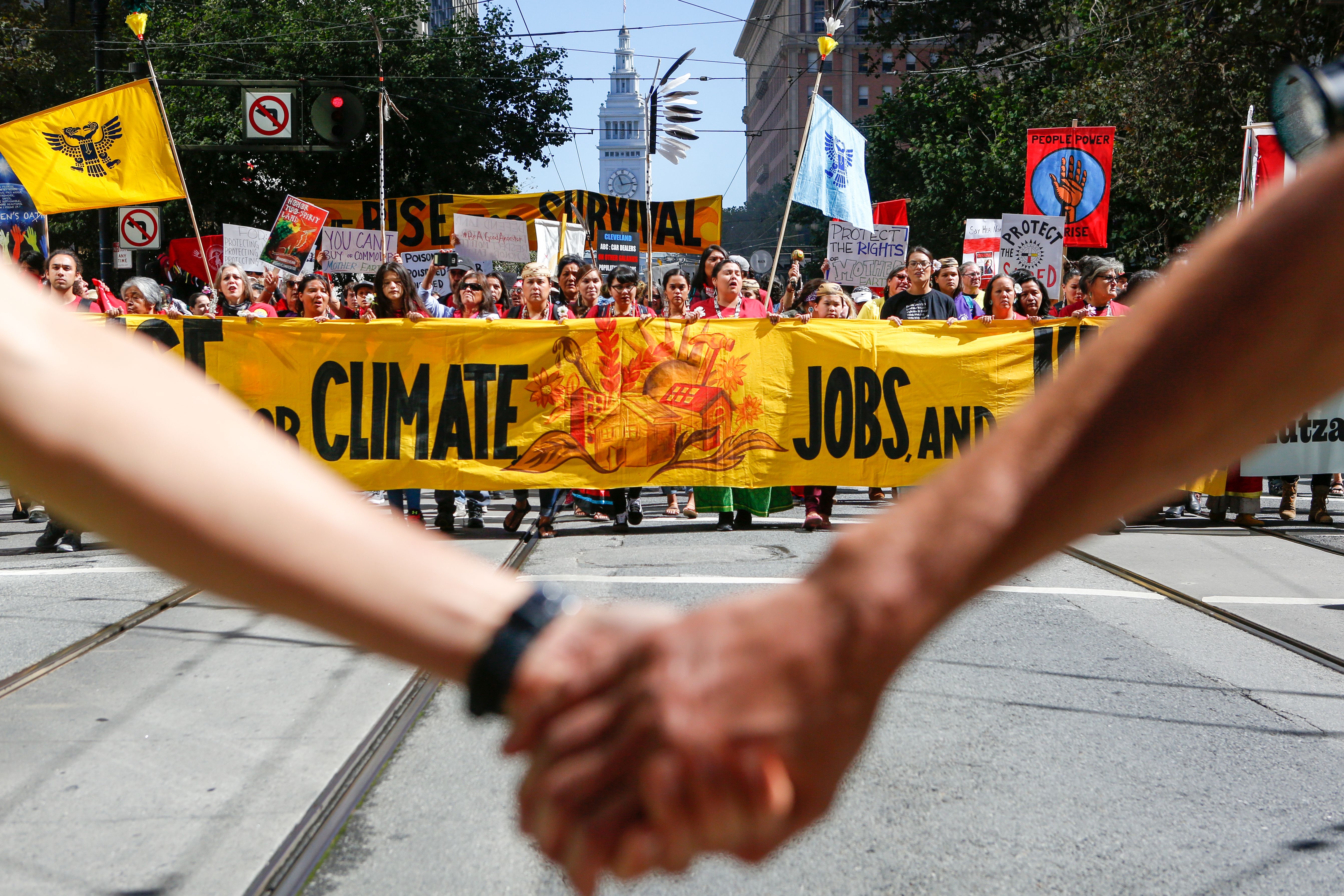 Demonstrators proceed up Market Street during the Rise for Climate global action in downtown San Francisco on September 8th, 2018, ahead of the Global Climate Action Summit.