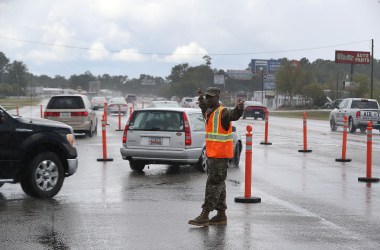 Traequan Shaw of the South Carolina National Guard directs traffic onto U.S. 501 in Myrtle Beach after the South Carolina government ordered that traffic use all the lanes on the route leading away from the coast to facilitate evacuation ahead of the arrival of Hurricane Florence on September 11th, 2018.