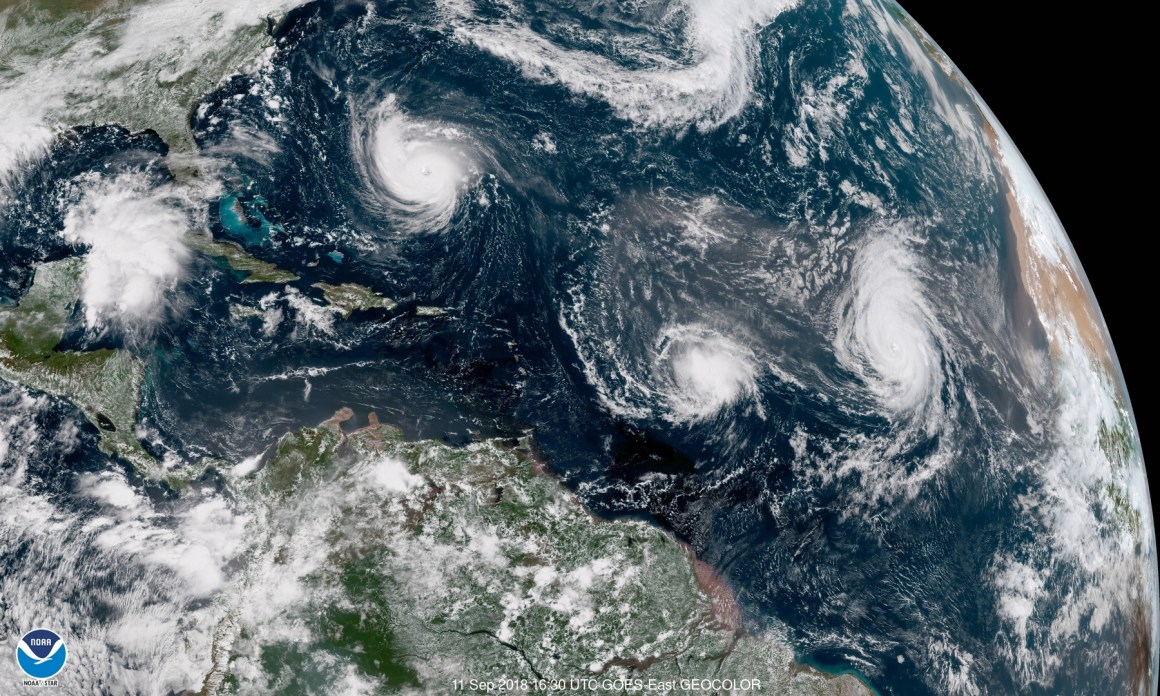 In this satellite image provided by the NOAA, Hurricane Florence churns through the Atlantic Ocean toward the U.S. East Coast, followed to the east first by Tropical Storm Isaac and then Hurricane Helene on September 11th, 2018.