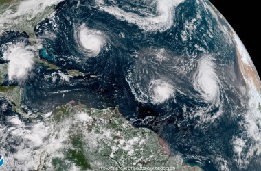 In this satellite image provided by the NOAA, Hurricane Florence churns through the Atlantic Ocean toward the U.S. East Coast, followed to the east first by Tropical Storm Isaac and then Hurricane Helene on September 11th, 2018.