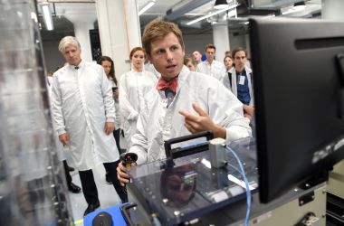 Chester Gillmore, senior vice president of manufacturing at Planet, introduces a satellite during a media tour at Planet's manufacturing facility in San Francisco on September 11th, 2018, during the Global Climate Action Summit.