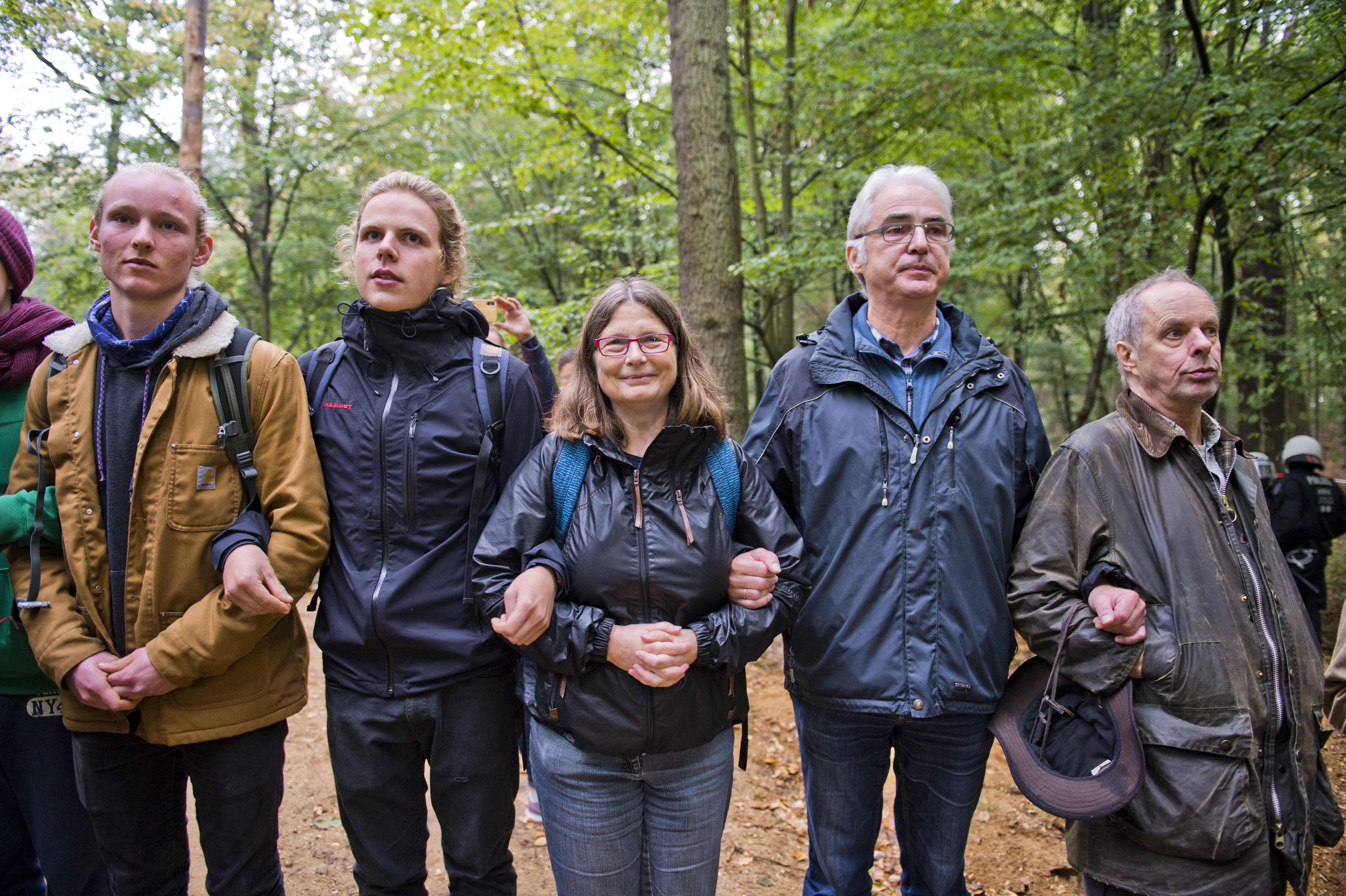 Activists hold each other tight in Hambach Forest during a protest against the expansion of an adjacent open-pit coal mine on September 13th, 2018, near Julich, Germany.