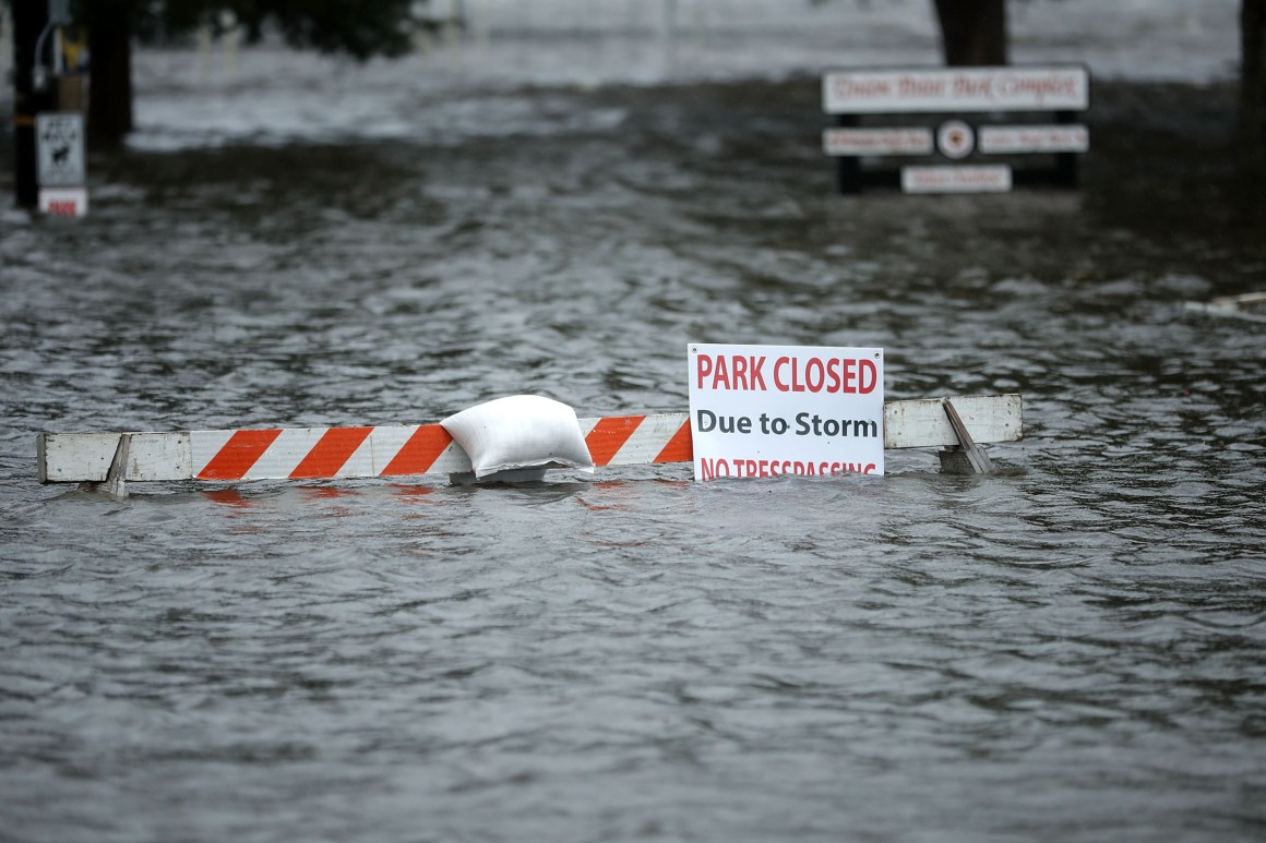 A sign warns people away from Union Point Park after it was flooded by the Neuse River during Hurricane Florence on September 13th, 2018 in New Bern, North Carolina.