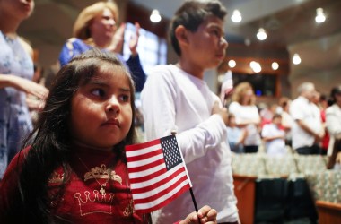 New U.S. citizen Davies Garcia, 11, originally from Mexico, stands with his sister, Valerie, during a naturalization ceremony conducted by U.S. Citizenship and Immigration Services on September 14th, 2018, in Los Angeles, California.