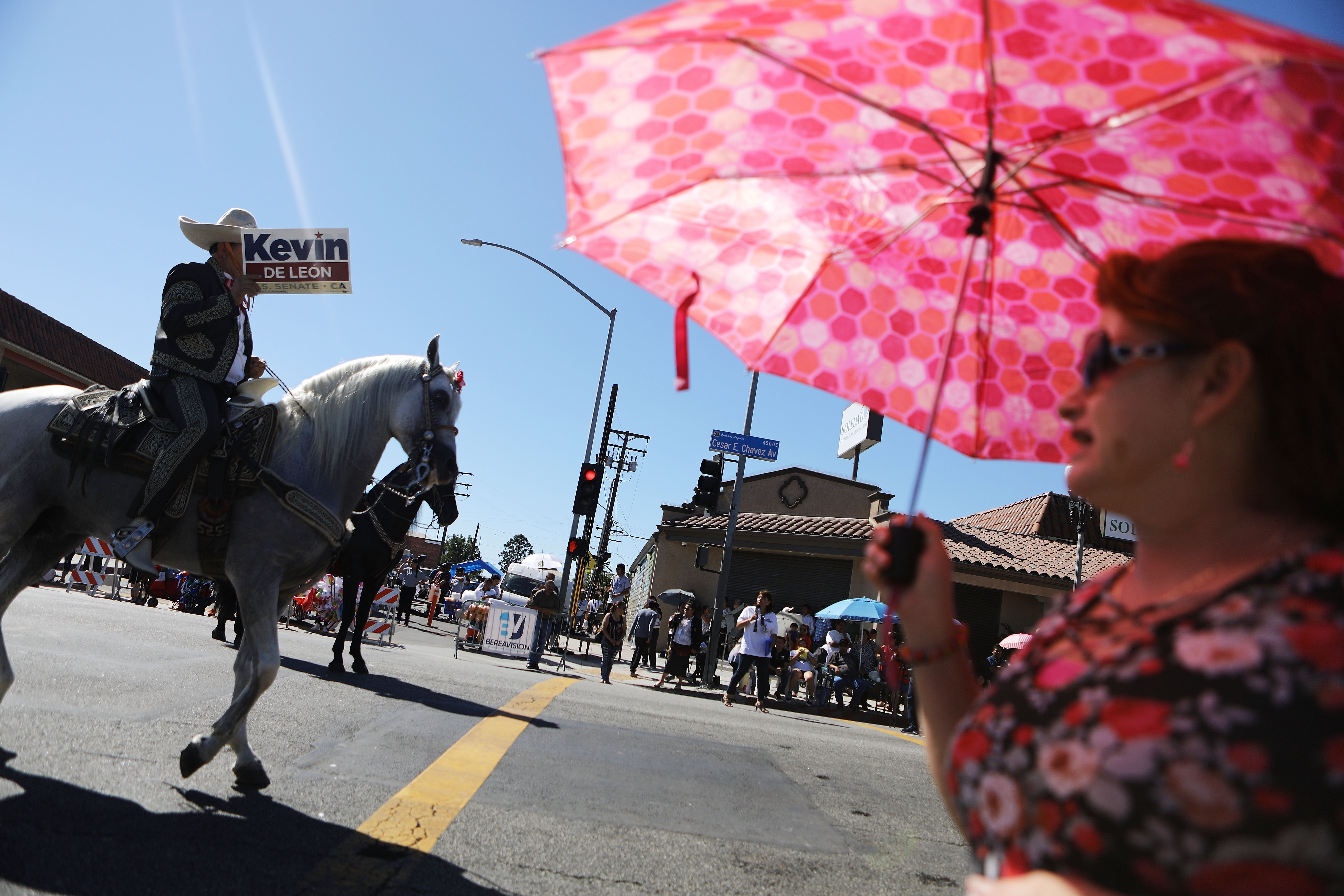 A horseback rider carries a sign in support of Kevin de León during the East L.A. Mexican Independence Day Parade on September 16th, 2018, in Los Angeles, California.