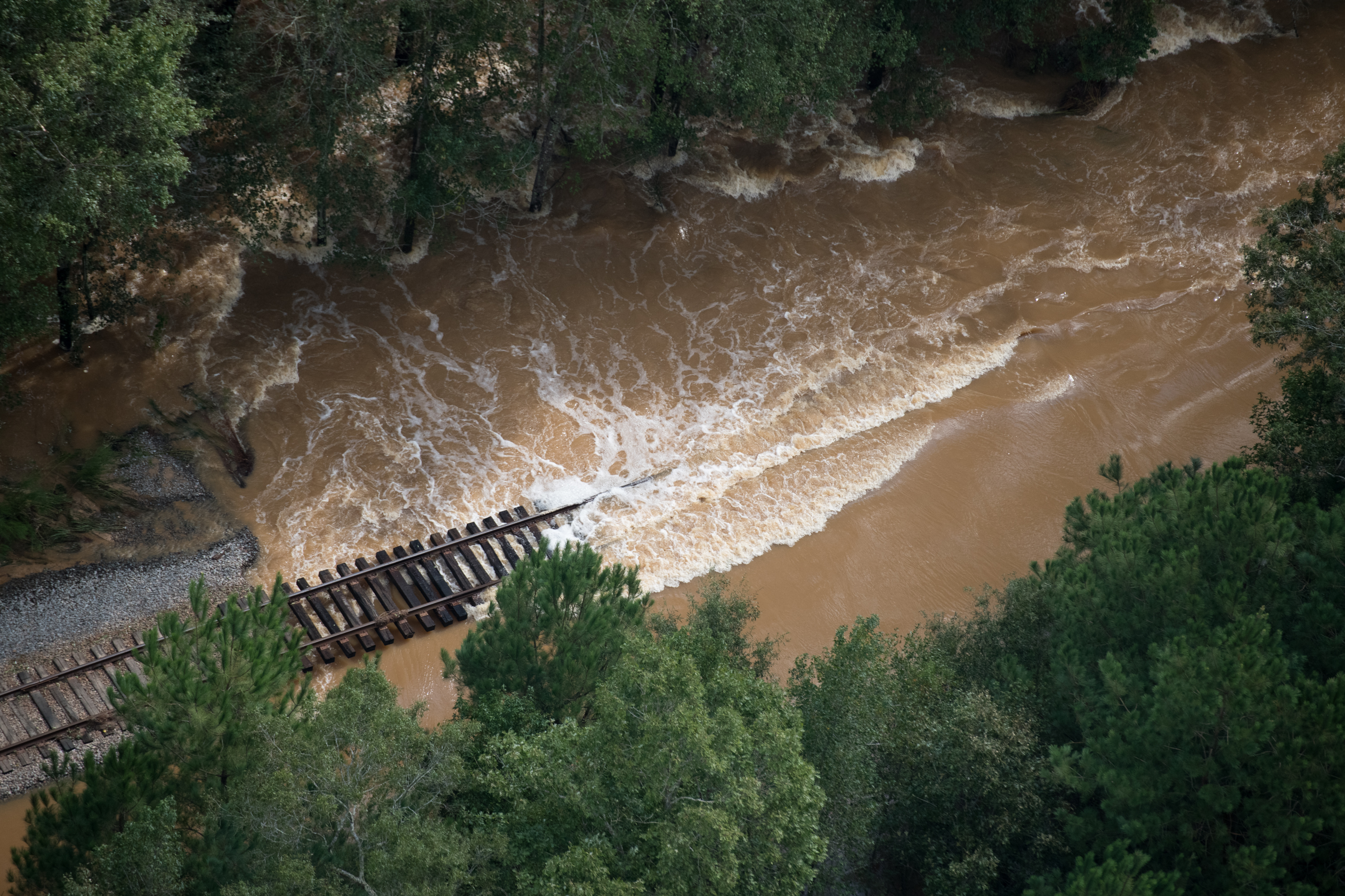 Floodwaters flow over train tracks on September 17th, 2018, in Dillon, South Carolina. Many rivers in the Carolinas were approaching record flood stages due to Hurricane Florence as their levels continued to rise through the week.