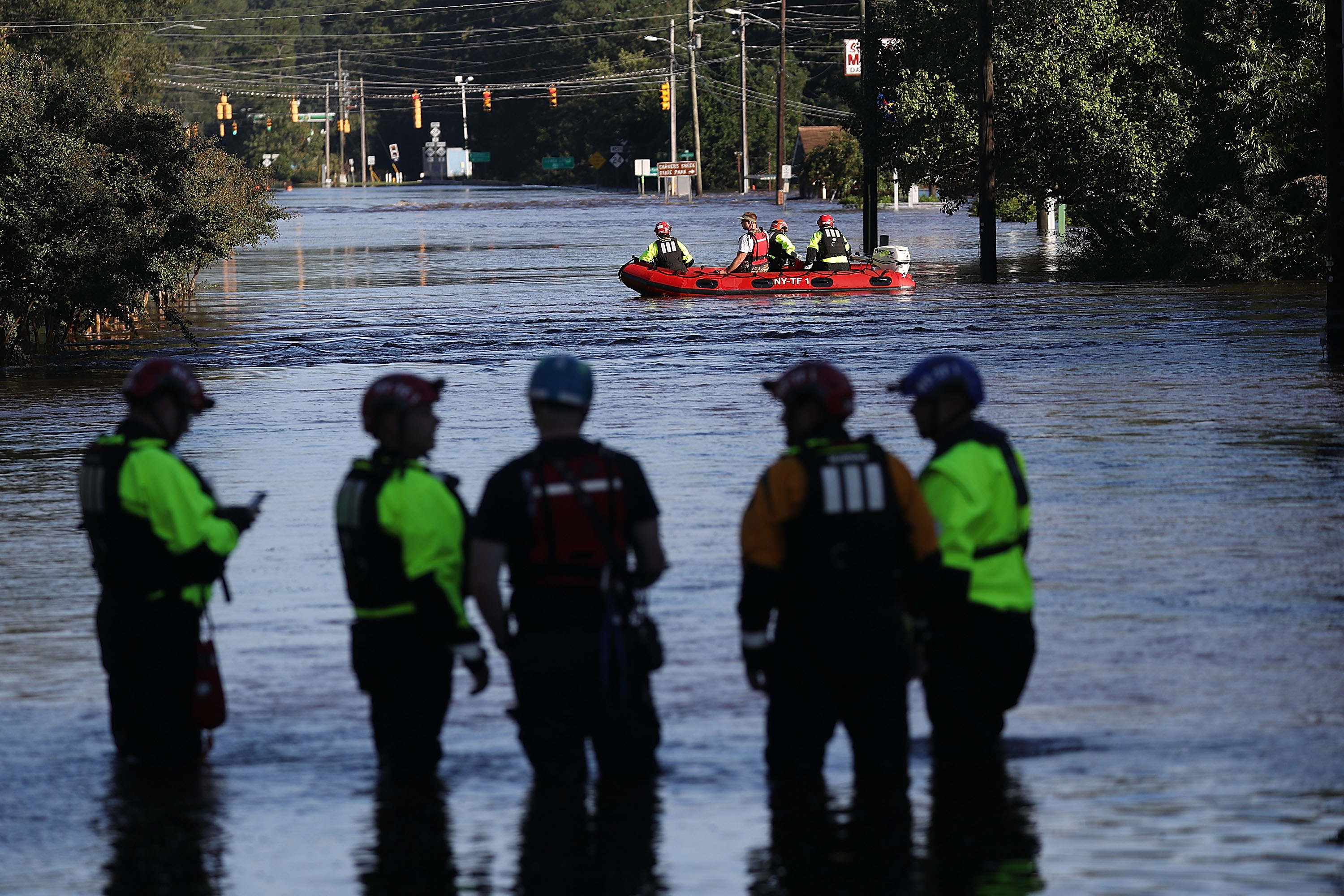 Members of New York Urban Search and Rescue Task Force One work in an area flooded with waters from the Little River as it crests from the rains caused by Hurricane Florence as it passed through the area on September 18th, 2018, in Spring Lake, North Carolina.