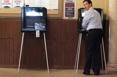 Marco Rubio stands at a voting machine on August 24th, 2010, in Miami, Florida.