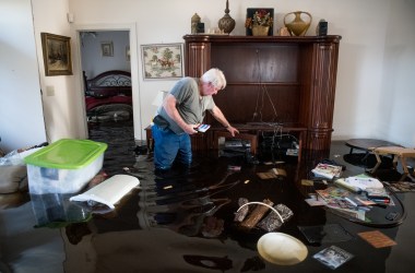 Billy Hardee removes valuables from his home as floodwater from Hurricane Florence rises at Aberdeen Country Club on September 20th, 2018, in Longs, South Carolina.