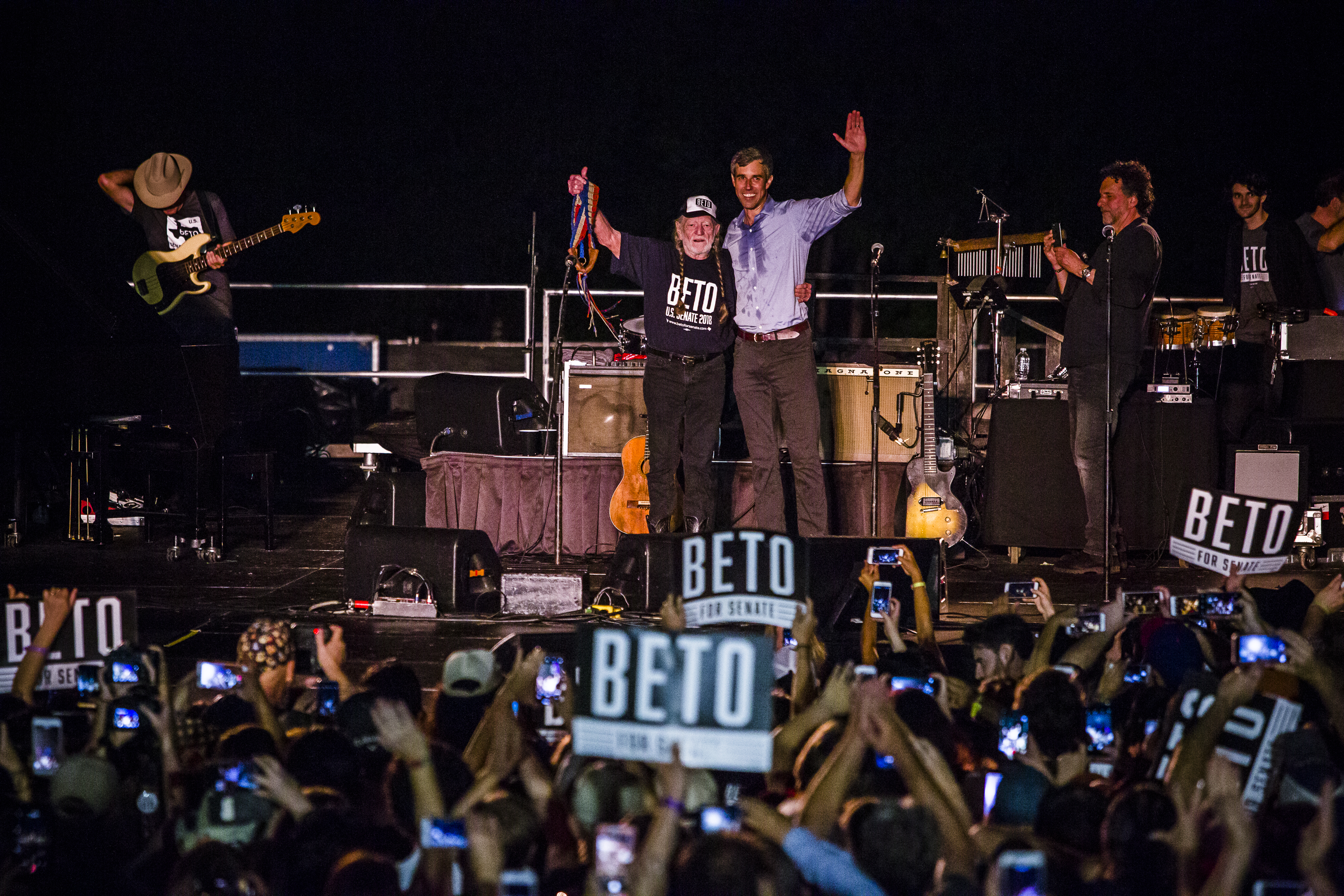 Representative Beto O'Rourke (D-Texas), joined by singer Willie Nelson, waves to supporters at a campaign rally at Auditorium Shores on September 29th, 2018, in Austin, Texas. O'Rourke is running against Republican incumbent Ted Cruz for his Senate seat.