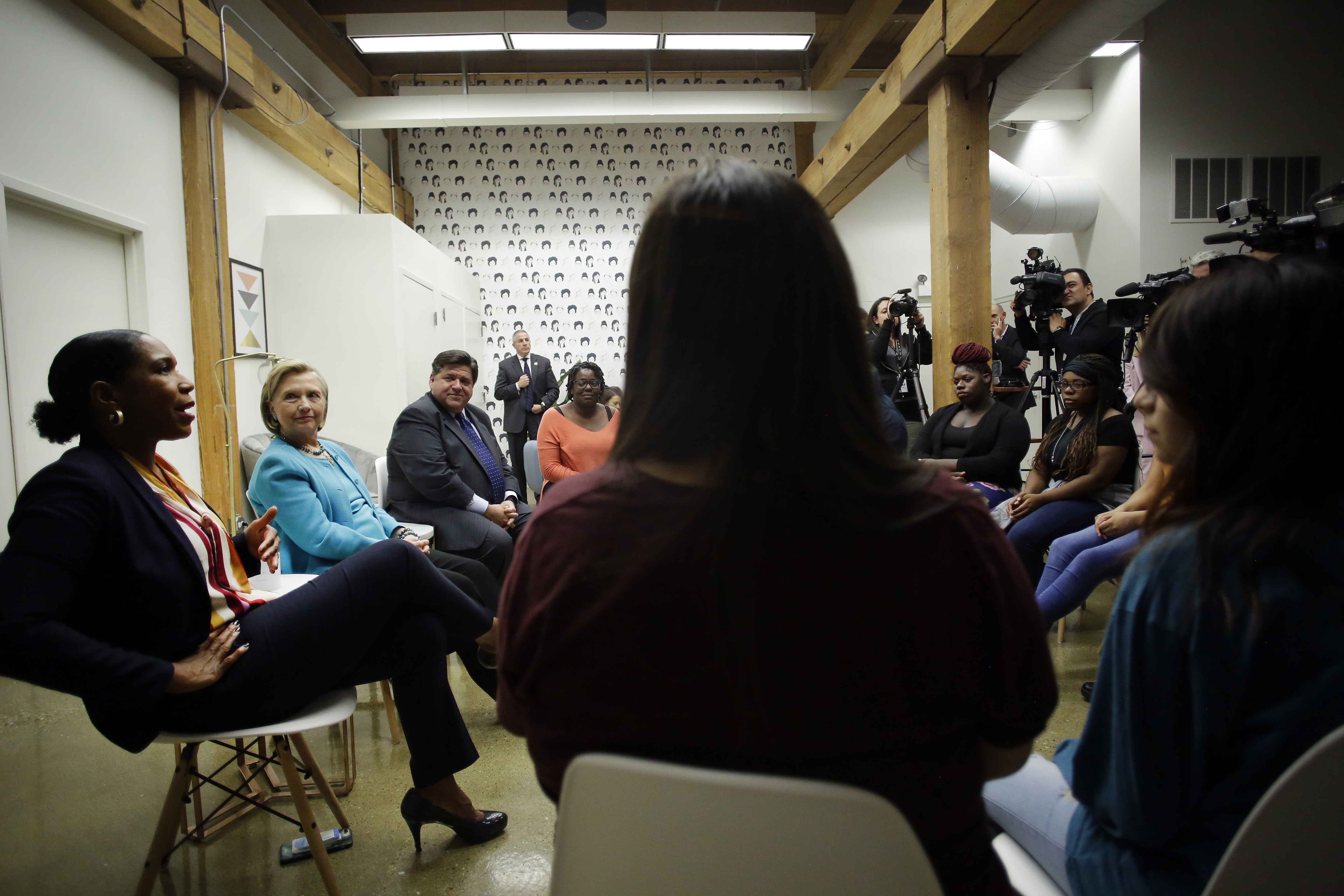 Illinois lieutenant governor candidate Juliana Stratton speaks with high school students during a round table discussion as former Secretary of State Hillary Clinton and Illinois gubernatorial candidate J.B. Pritzker listen at a creative workspace for women on October 1st, 2018, in Chicago, Illinois. Stratton, Clinton, and Pritzker spoke to students about leadership.