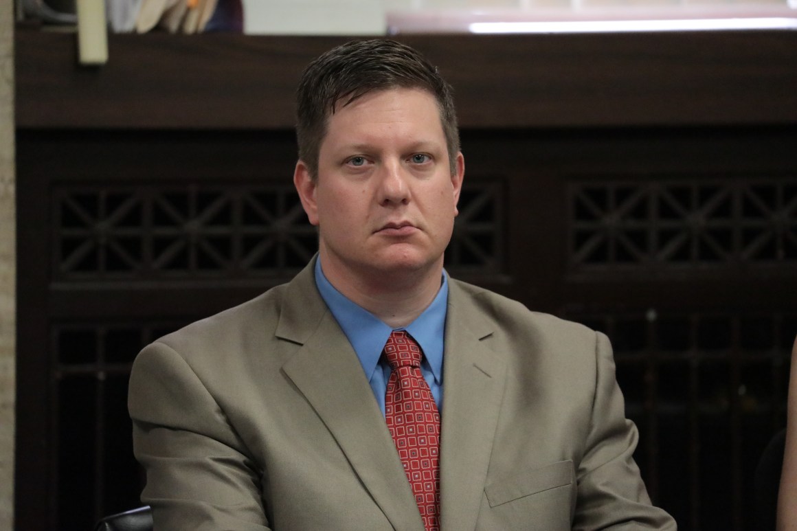 Chicago police Officer Jason Van Dyke watches the closing statements during his trial in the shooting death of Laquan McDonald, at the Leighton Criminal Court Building on October 3rd, 2018, in Chicago, Illinois.