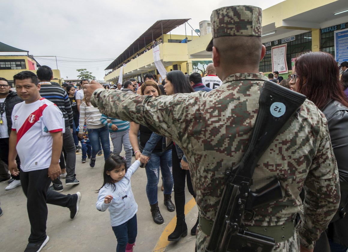 A Peruvian soldier stands guard at a polling station during municipal elections in Lima, Peru, on October 7th, 2018. More than 23 million Peruvians have been called to the polls to elect regional governors and mayors.